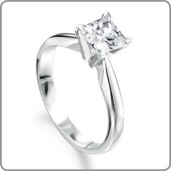 It was a single stone ring with a rectangular cut diamond sitting within a